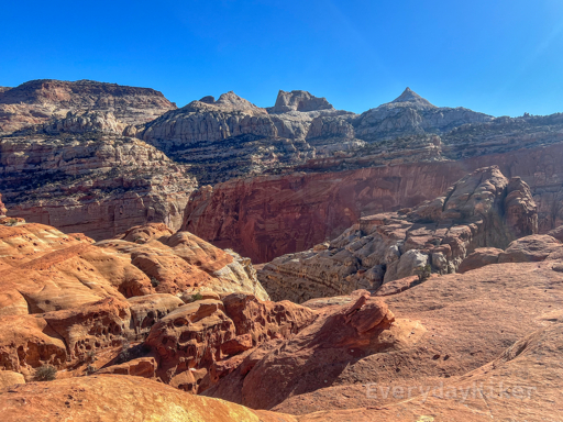 At the start of the large plateau near the turnaround, the many differing geologic formations may be seen, including Fern's Nipple along the top of the ridge right of center.